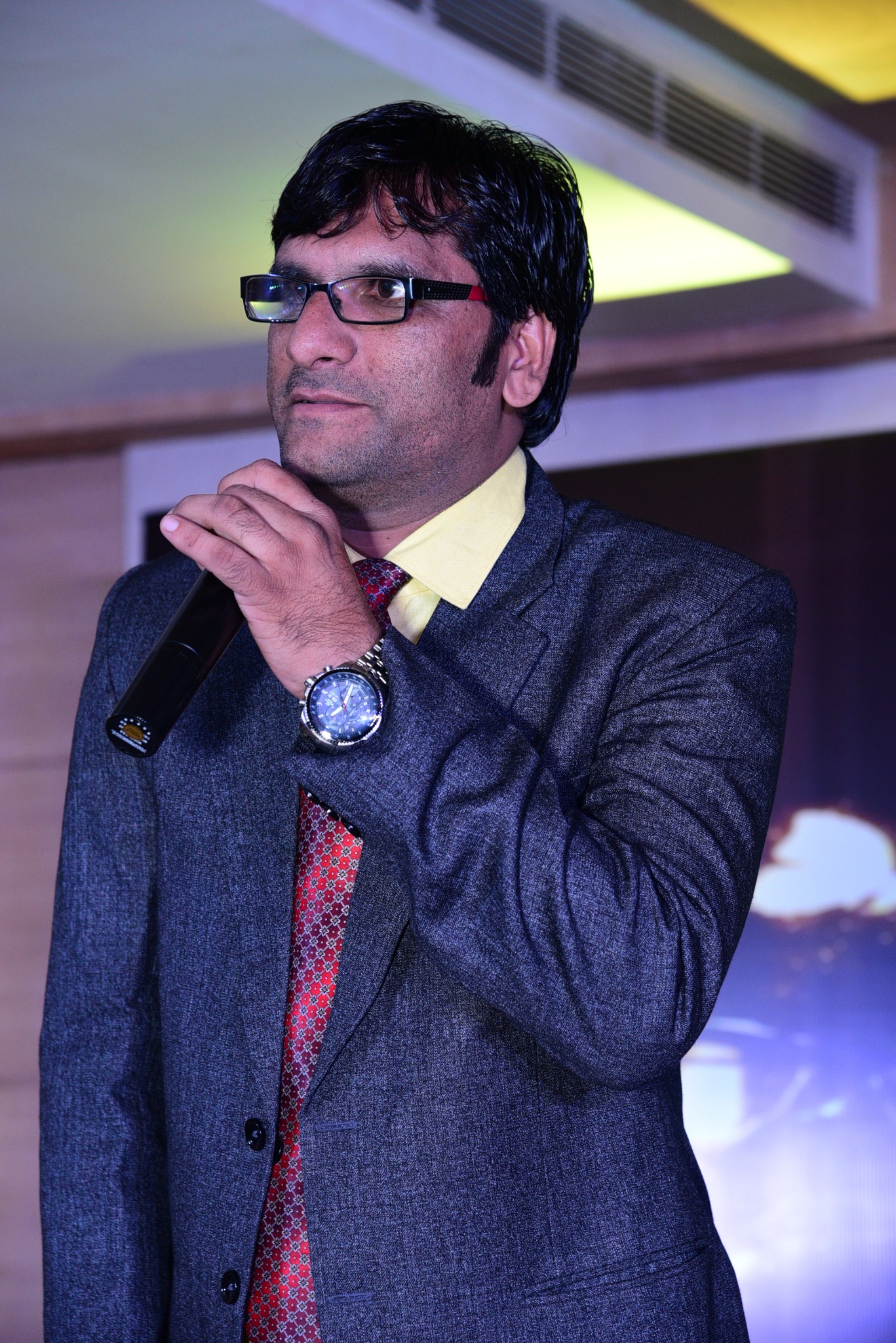 Dr. Santosh Patidar inspiring an audience from the stage